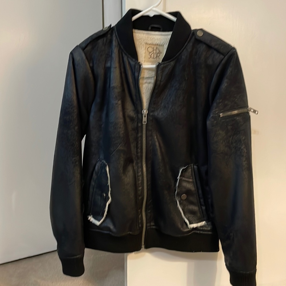 Black bomber jacket with cream shearling inside. Size Small